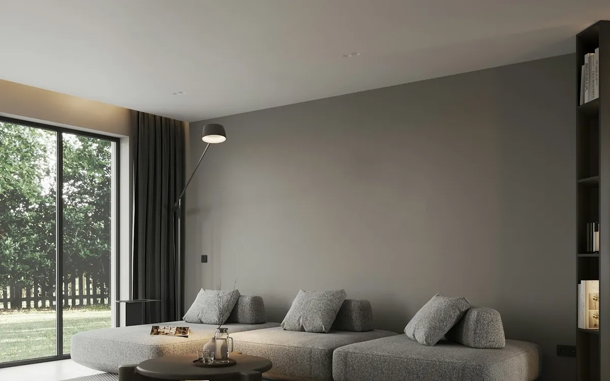 Modern living room with arched doorway and warm pendant light