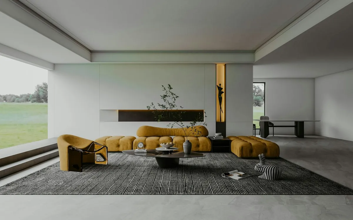 Open white room with large windows and a minimalist lounge area