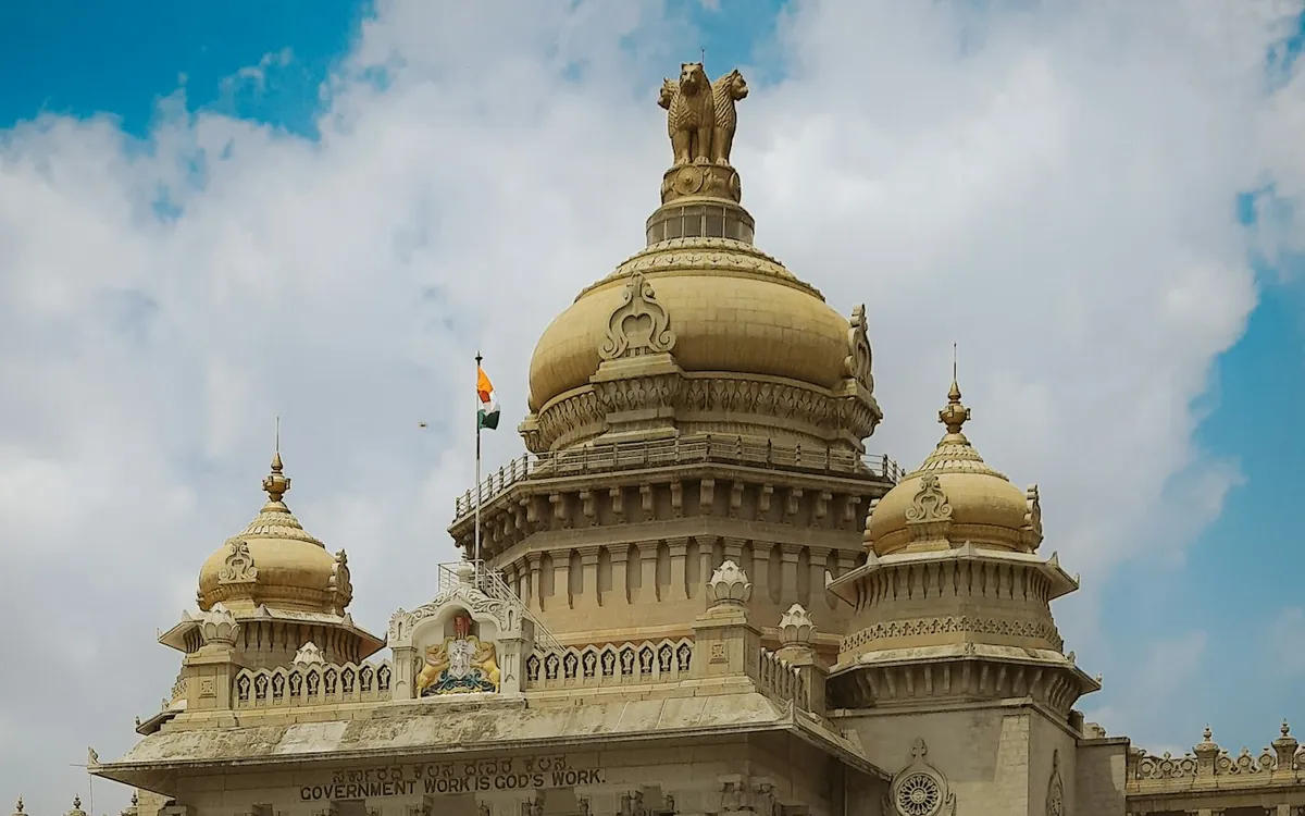 Golden-domed government building in Bengaluru with trees in front