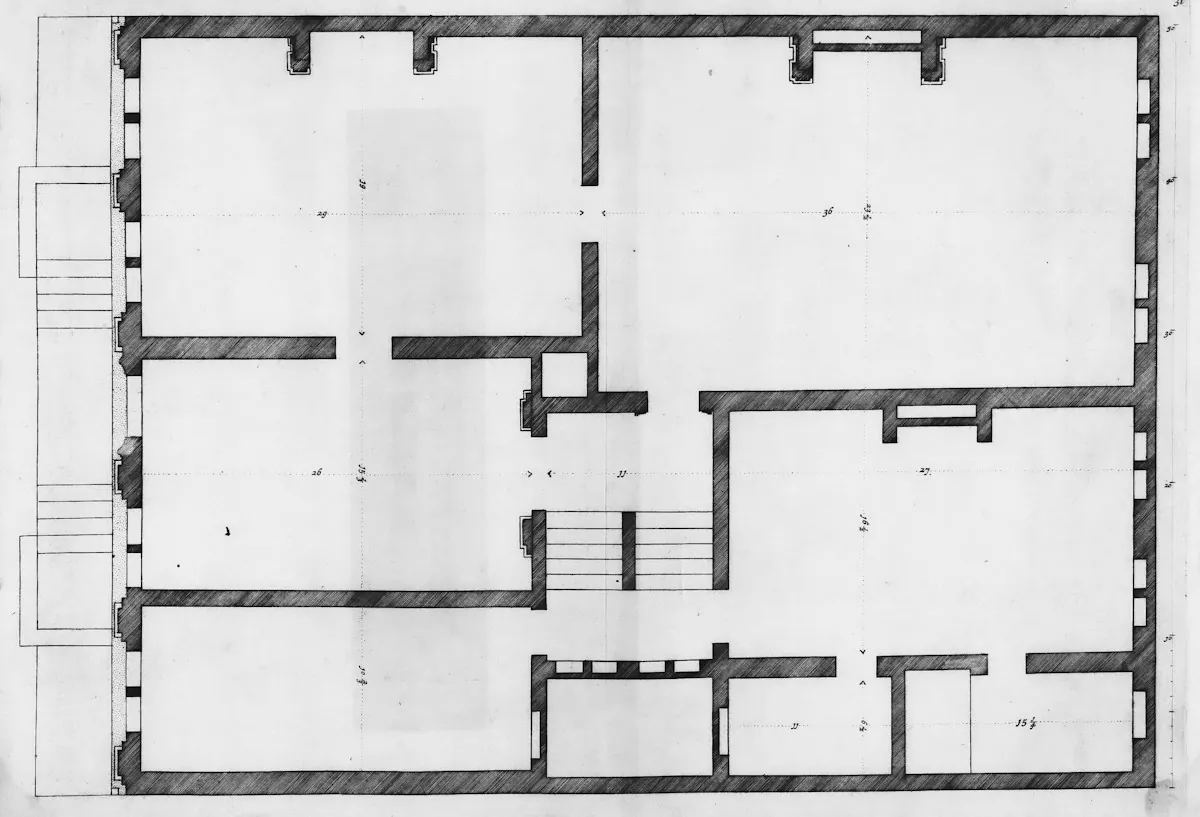 Architectural floor plan drawing of a building with rooms and a staircase