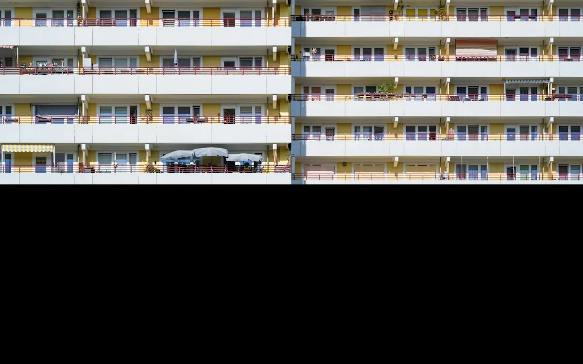 Modern residential building facade with rows of balconies