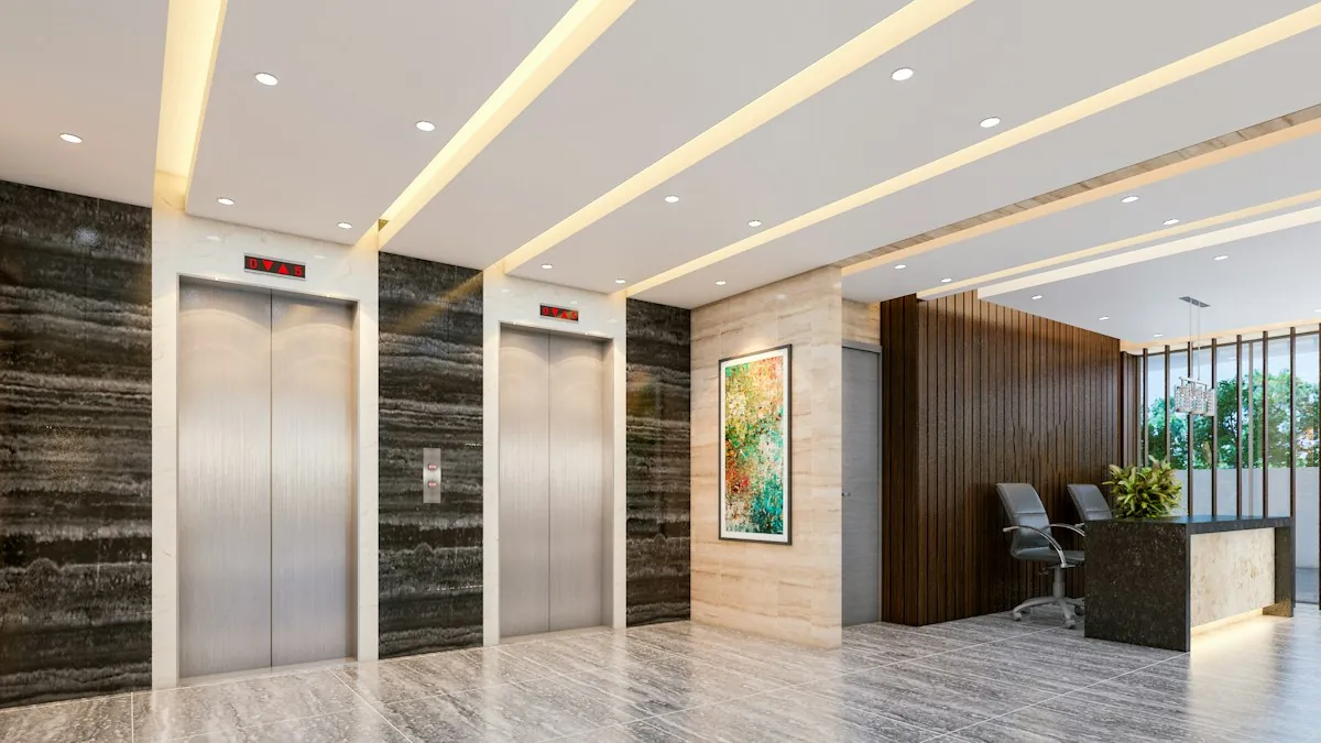 Modern lobby with two stainless steel lifts beside a reception desk