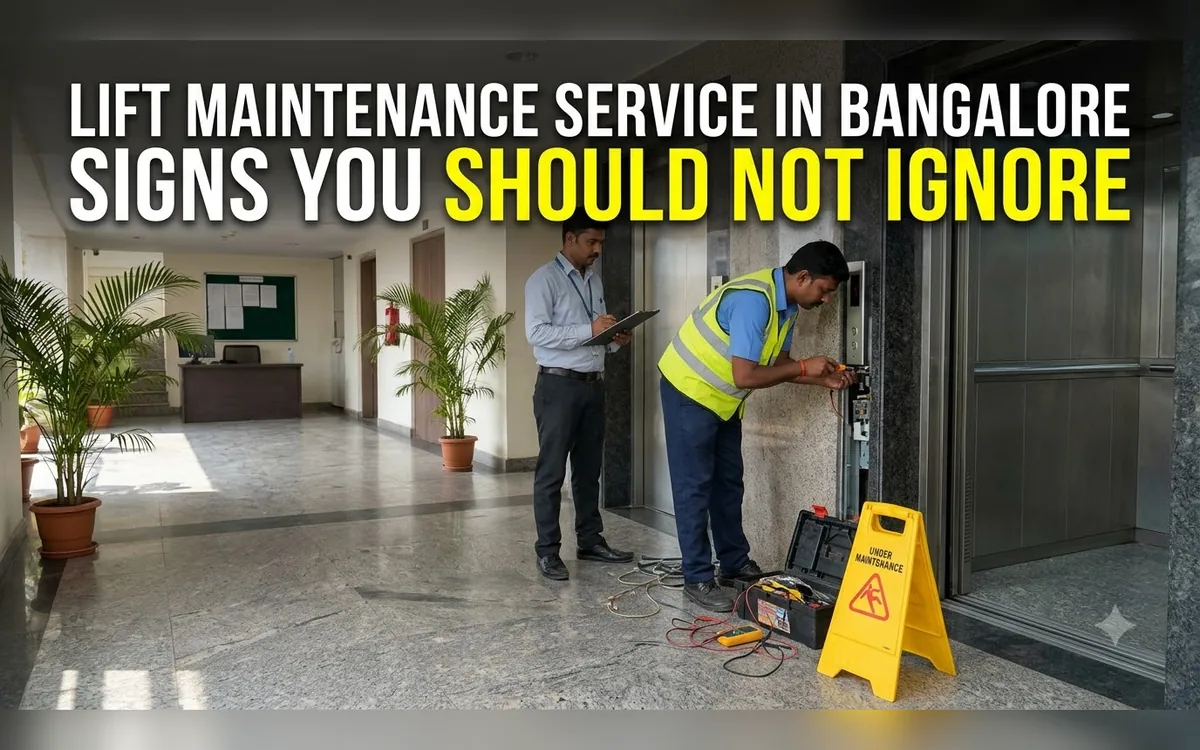Technician working on lift wiring beside a caution sign while a colleague watches in a Bangalore lobby