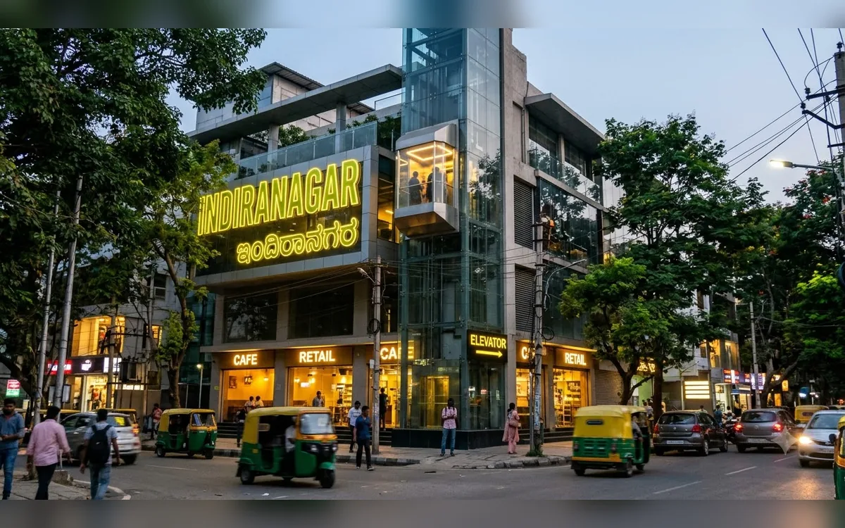 Elevator beside a boutique building on a busy Indiranagar street