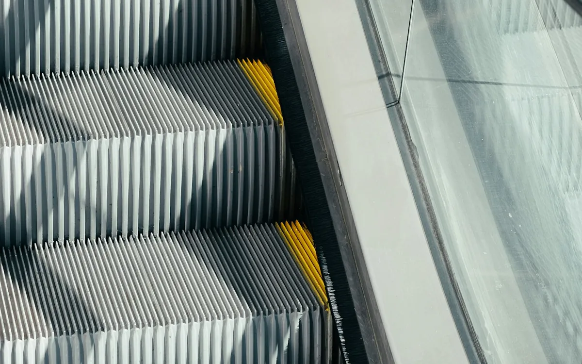 Silver and black escalator in a modern building