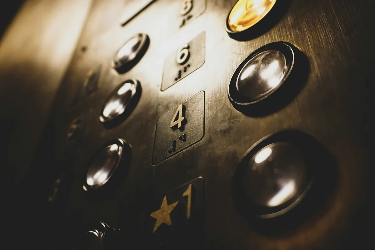 Close-up of metal lift buttons inside a lift cabin