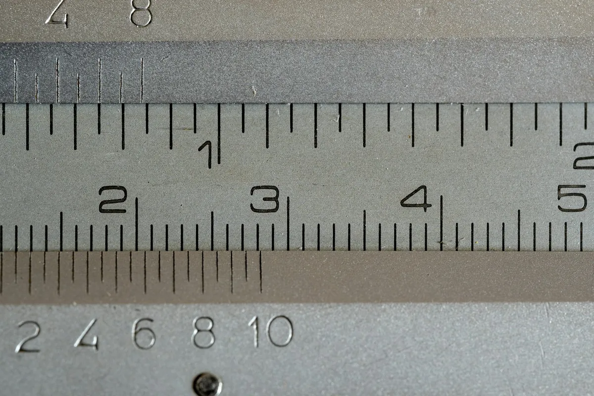Close-up of a metal ruler and measuring scale with numbers