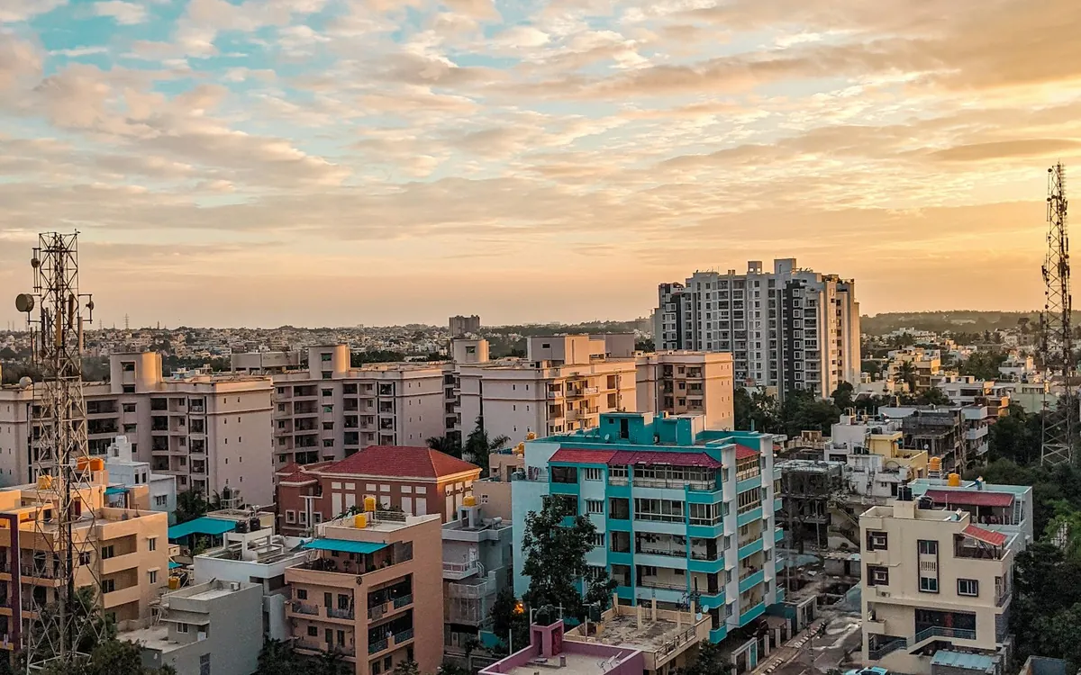 Evening view over a Bangalore neighbourhood with apartments and trees