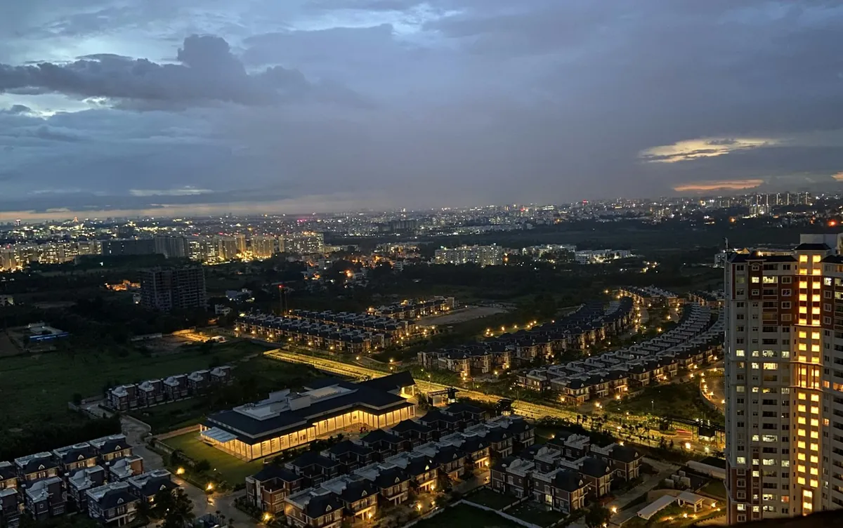 Aerial view of Bengaluru buildings and roads at dusk