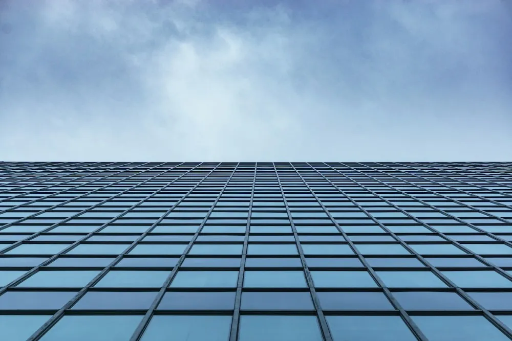 Glass facade of a modern building rising into the sky