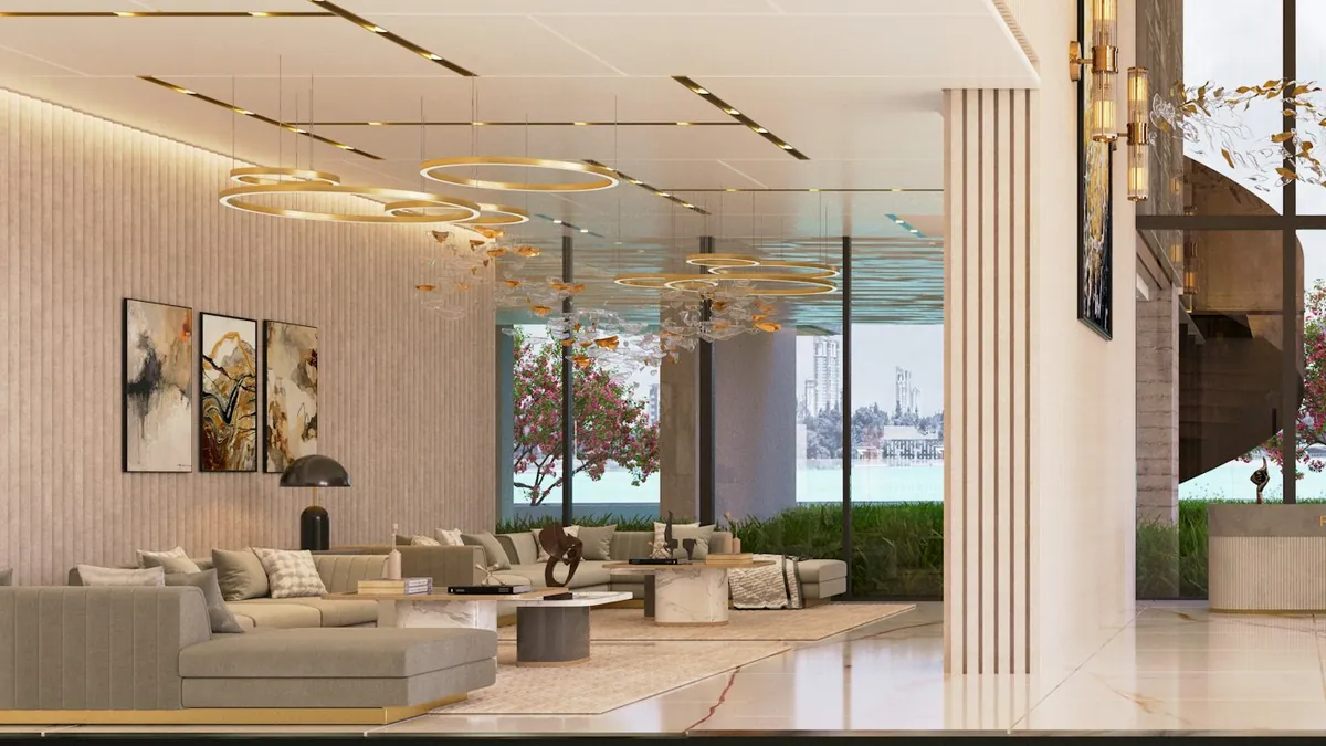 Elegant lobby lounge with warm lighting, gold ring lamps and large windows