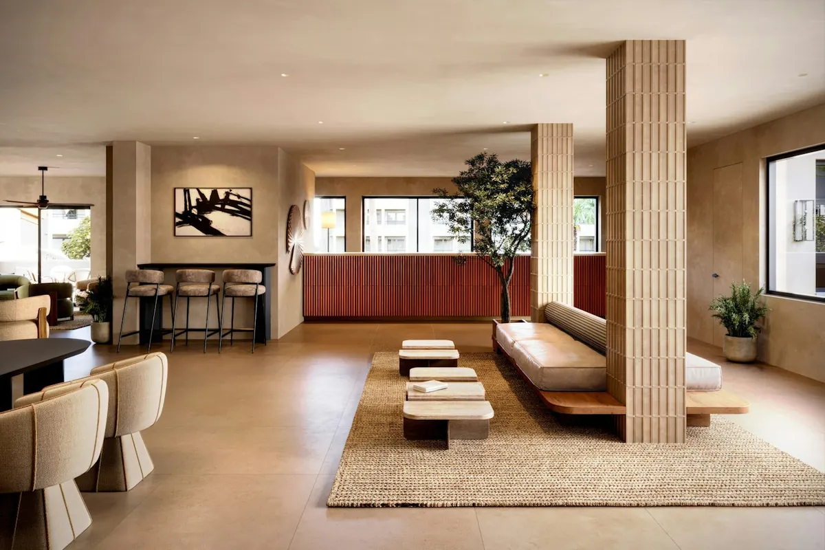 Warm modern lounge with plants, a feature column and neutral furniture