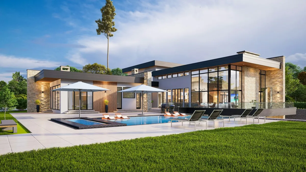Modern clubhouse-style building with a long pool, umbrellas and glass walls at dusk