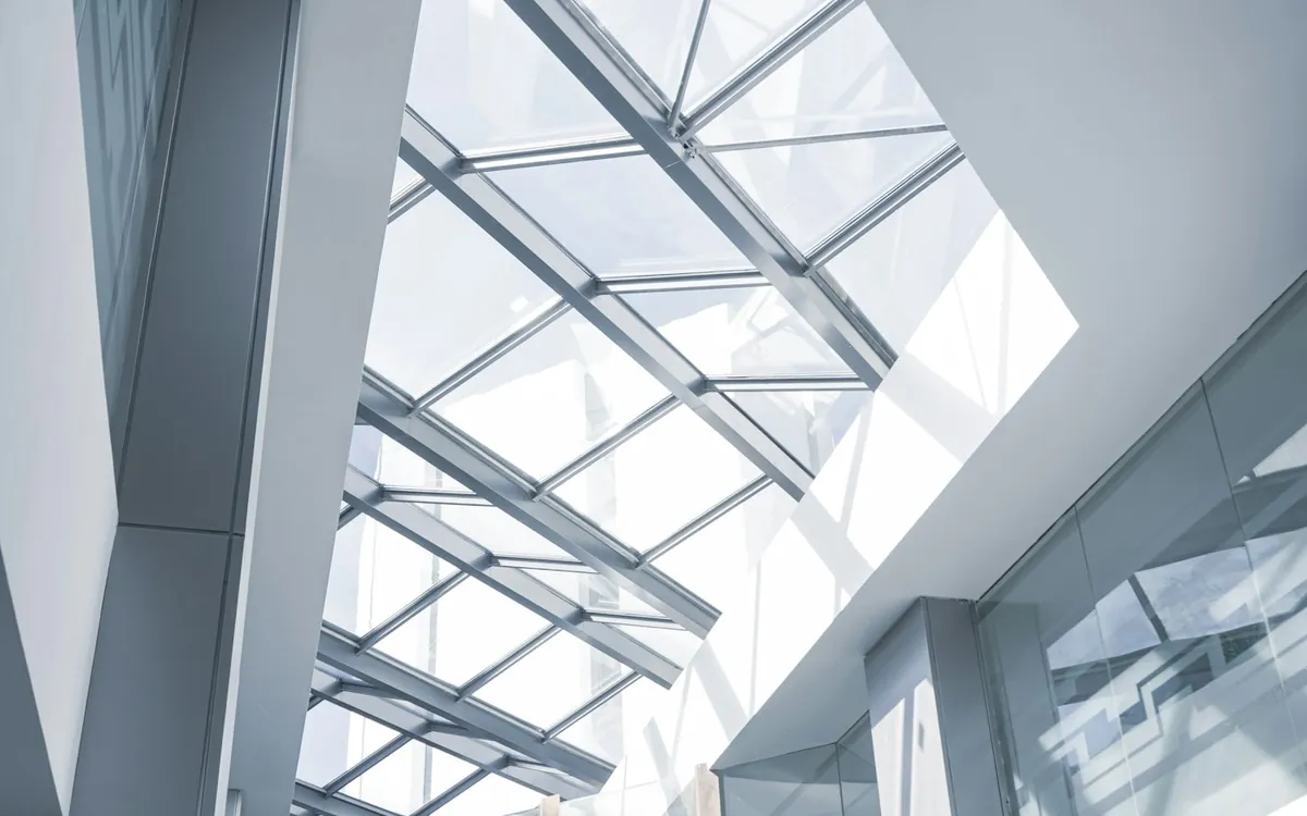 Skylight over a modern glass and steel building seen from below