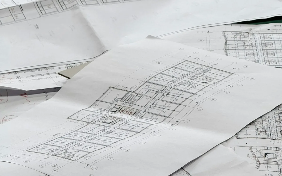 Architectural plans spread out on a table